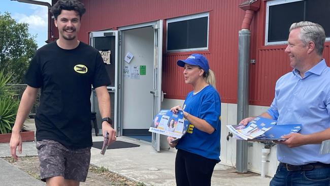 Fadden MP Cameron Caldwell (right) and his wife Lauren hand out how-to-vote cards for the party's candidate Bianca Stone in Gaven on election day. Picture: Paul Weston.