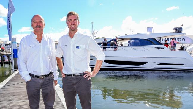 Maritimo General Manager Phil Candler, designer Tom Barry-Cotter and the newly unveiled X50 at the Sanctuary Cove Boat Show. Pic Tim Marsden