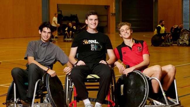 Conor Tweedy with Nick Aitkin and Ben Hearne trying out wheelchair rugby. The trio now coach the Terrace 9Bs. (AAP/Image Steve Pohlner)