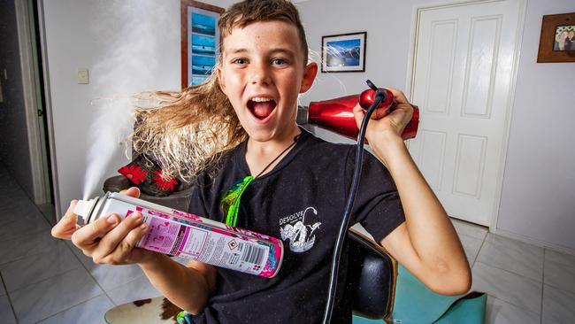 Elijah Gunn, 8, celebrates winning the best mullet. Picture: Nigel Hallett