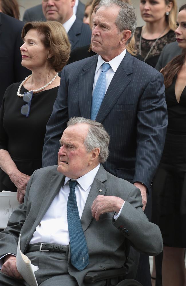 Former president George H.W. Bush with his son former president George W. Bush and former first lady Laura Bush. Picture: AFP