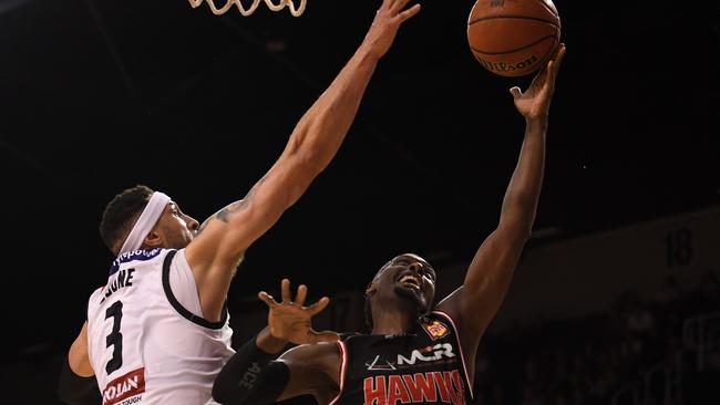 Cedric Jackson stretches for a shot over Josh Boone.