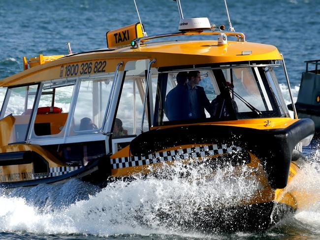 The couple enjoy the ride out to Rose Bay. Picture: John Grainger