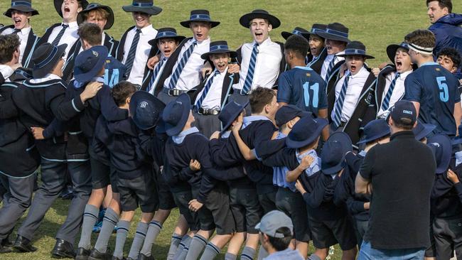 Brisbane Grammar run onto the field, with Lewis Strachen (No. 14), Shannon Simpson (No. 11) and Charlie McCauley in the picturePicture: Richard Walker