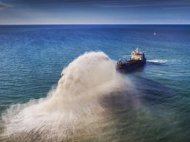 The 111 meter dredge replenishing sand is back in action at Palm Beach, Gold Coast. Picture: NIGEL HALLETT