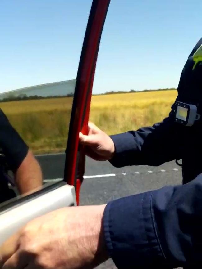 Finally, a second cop joins the exchange and reaches into the car, restraining the man. Picture: YouTube.