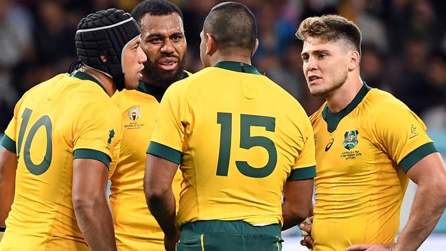 Wallabies Christian Lealiifano (L), Marika Koroibete (facing), Kurtley Beale (second right) and James O'Connor (right) during the Wallabies’ opening World Cup match against Fiji. Picture: AFP