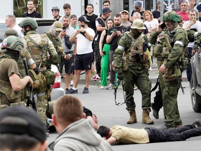 Wagner Group soldiers detain a man in the city of Rostov-on-Don, on Saturday. Picture: AFP