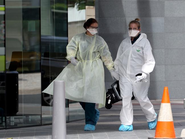 Paramedics outside the Gold Coast Peppers Resort. Picture: MEGA ]