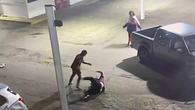 A man is set upon by a young Indigenous man wielding a wheel brace where he is viciously beaten after falling to the ground.