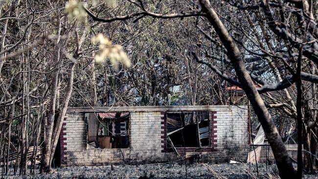 Property damage in the aftermath of a severe grass fire on Mira Rd, Southport. Picture: Glenn Campbell