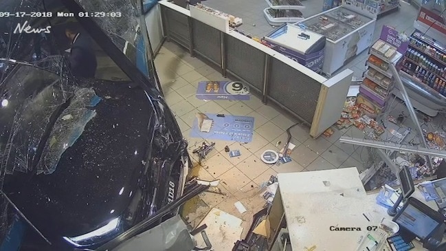 Man bashes and drags pregnant woman, drives his car through service station window as she cowers inside