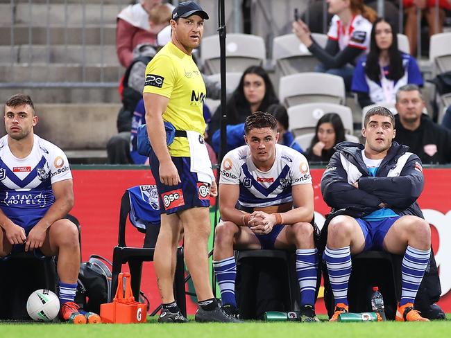 Flanagan sits forlornly on the sidelines after being hooked by Trent Barrett.