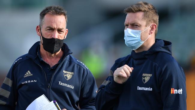 Alastair Clarkson and Sam Mitchell on the sidelines.