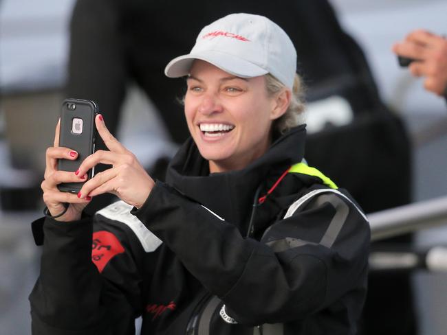 Kristy Hinze, the Australian wife of Comanche owner Jim Clark on board the yacht as it neared the finish on Monday night.