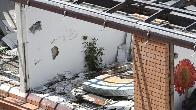 These derelict buildings in Enid St Tweed Heads are a haven for “junkies” and the homeless, and worst of all, sit just metres from a Catholic primary school. Picture: Glenn Hampson