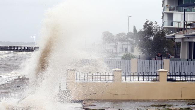 Wild weather combined with a high tide sent water into homes at Woody Point. Picture: Richard Gosling