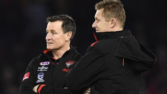 Essendon coach John Worsfold talks to assistant Mark Neeld.