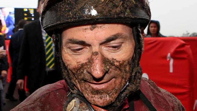 Robbie Fradd was covered in mud after riding in the Queensland Cup. Picture: Tim Marsden