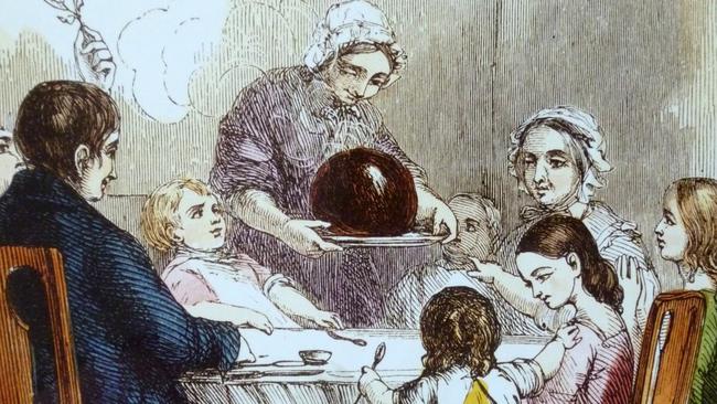 History: Presenting the plum pudding, a 19th century illustration of a Christmas feast. Out of copyright