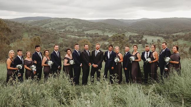 The 18-person wedding party at Adam and Rupert's country wedding on their property near Moore.