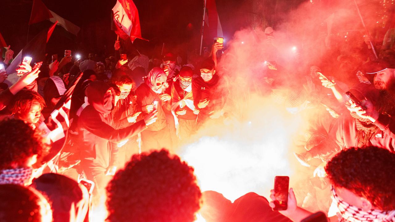 The group set off multiple flares. Picture: David Swift