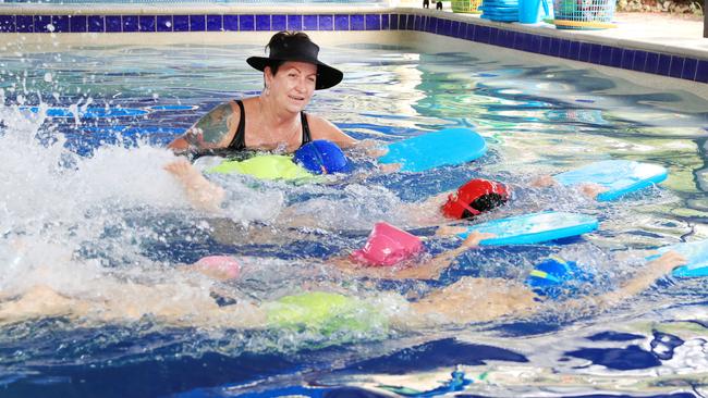 Veteran Cairns swim coach Janet Evans has backed SOS but thinks kids should be getting in the water from 5-6 months old. Janet is pictured with Casey Schuberg, Natalie Mase, Aria Eldred and Zoe Rokstad PICTURE: JUSTIN BRIERTY