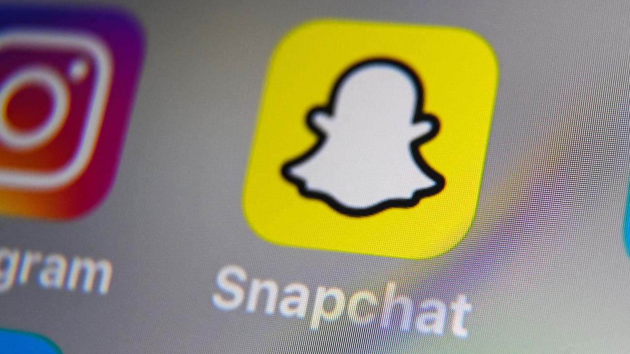 Organised crime networks are using social media apps like Snapchat, Instagram, and TikTok to lure in young men. Picture: Denis Charlet/AFP.