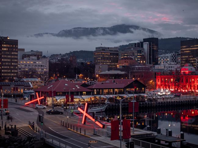 Crosses on the Hobart waterfront as part of Dark Mofo.  Picture: Darklab