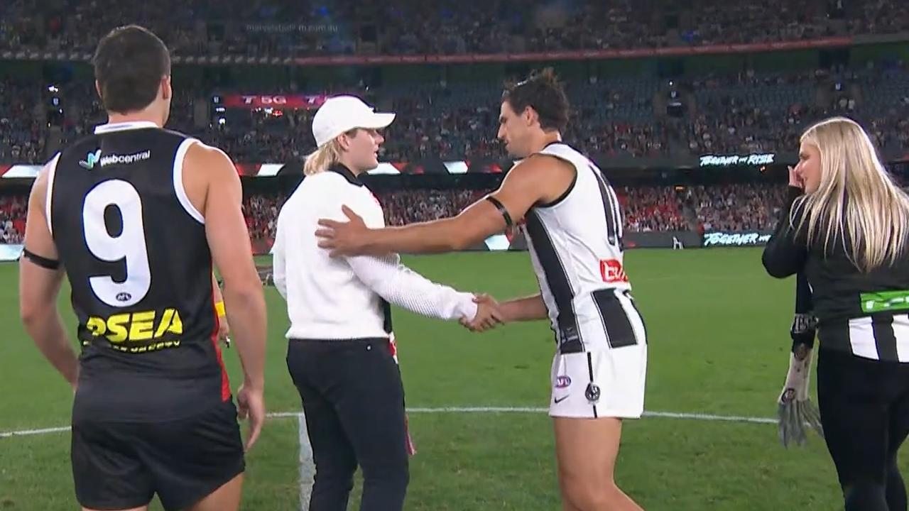 Jackson Warne shaking hands with Scott Pendlebury. Photo: Kayo.