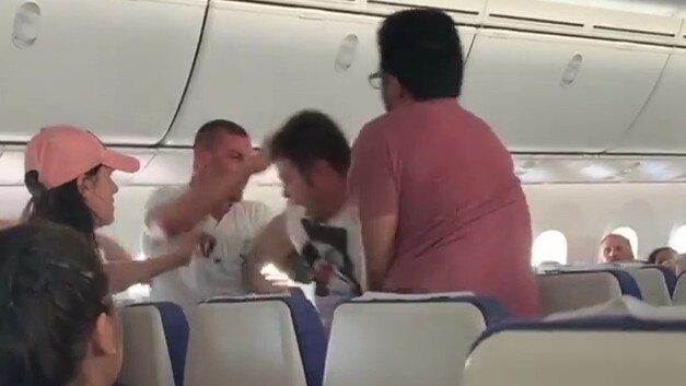 Dramatic video has emerged of a passenger on a flight to Singapore fighting after take-off. Picture: Rico David Garilli/Facebook 