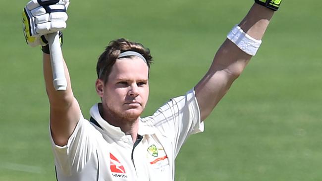 Australian captain Steve Smith celebrates his century against India in the first Test in Pune.