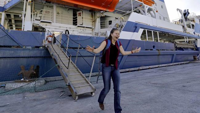 Researcher Daria Gritsenko steps onto land for the first time since setting sail aboard the Finnish icebreaker MSV Nordica as it arrives into Nuuk, Greenland, after traversing the Northwest Passage through the Canadian Arctic Archipelago, Saturday, July 29, 2017. After 24 days at sea and a journey spanning more than 10,000 kilometers (6,214 miles), the MSV Nordica has set a new record for the earliest transit of the fabled Northwest Passage. The once-forbidding route through the Arctic, linking the Pacific and the Atlantic oceans, has been opening up sooner and for a longer period each summer due to climate change. (AP Photo/David Goldman)