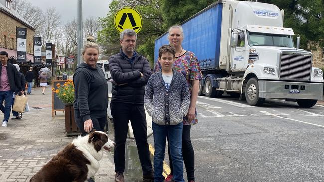 Hahndorf locals Catherine McLeod, with her dog Hunter, Jeremy Roberts, Cathryn Nitschke and son Solomon Nitschke in the Main Street. Picture: Dylan Hogarth