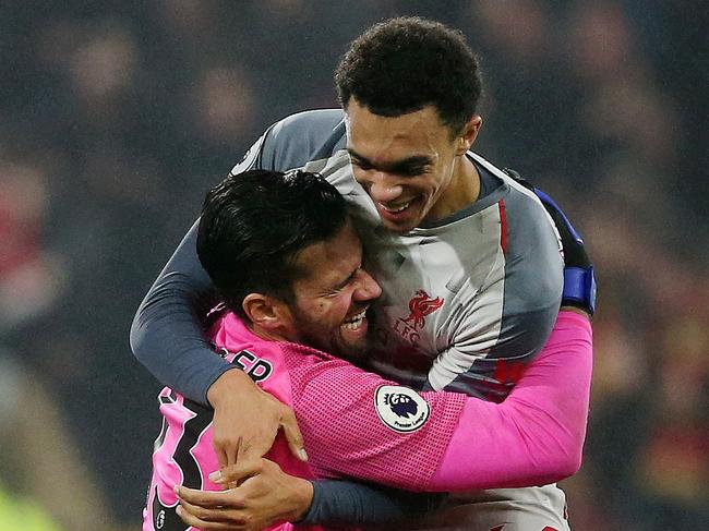 BURNLEY, ENGLAND - DECEMBER 05:  Alisson of Liverpool and Trent Alexander-Arnold of Liverpool celebrate following their sides victory in the Premier League match between Burnley FC and Liverpool FC at Turf Moor on December 5, 2018 in Burnley, United Kingdom.  (Photo by Nigel Roddis/Getty Images)