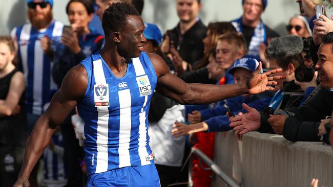 Daw runs to the field to the delight of fans. Picture: Graham Denholm/Getty Images)