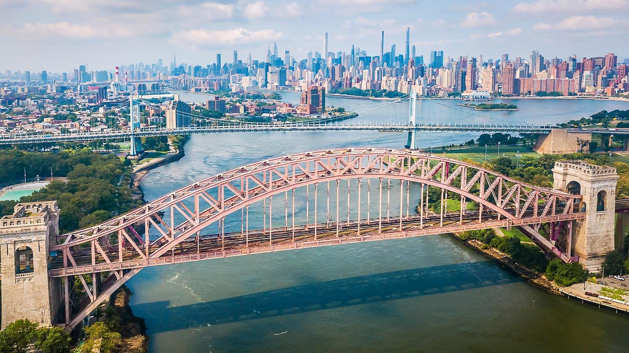 It’s off the tourist track., but the skyscrapers of Manhattan are visible from the Hell Gate Bridge.