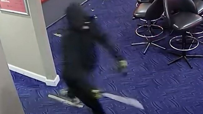 Police have released CCTV footage of a Whyalla hotel robbery showing a man with a large knife charging through a gaming room moments before he stole cash. Picture: SA Police