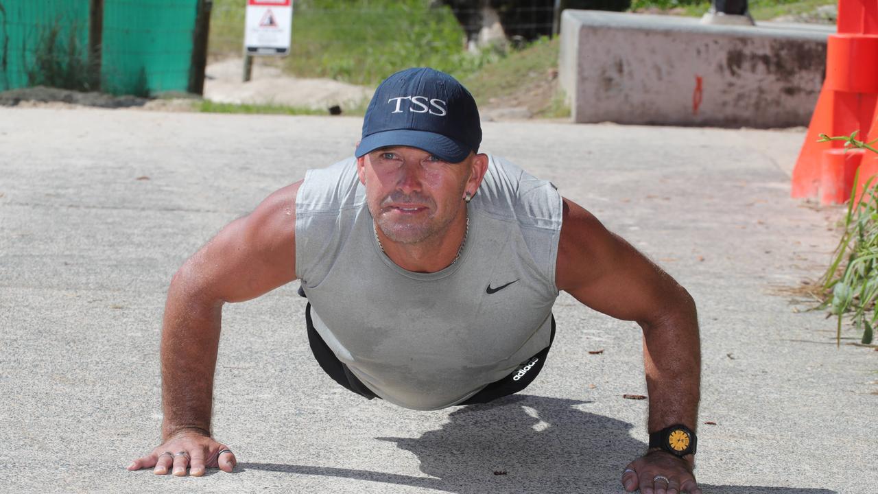 Brock Merrion from Burleigh does push ups. Picture Glenn Hampson