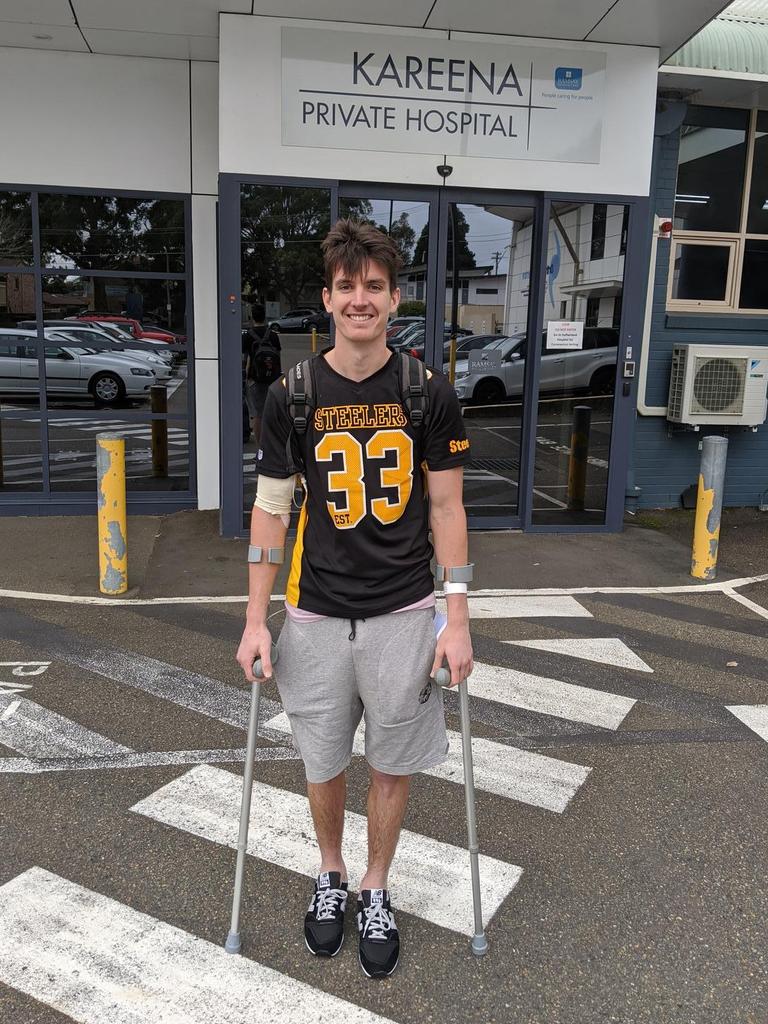 GWS’s Sam Taylor leaves hospital on crutches.