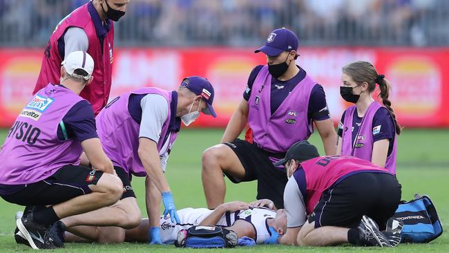 There was concern for Darcy Tucker after an awkward tackle. (Photo by Will Russell/AFL Photos via Getty Images)