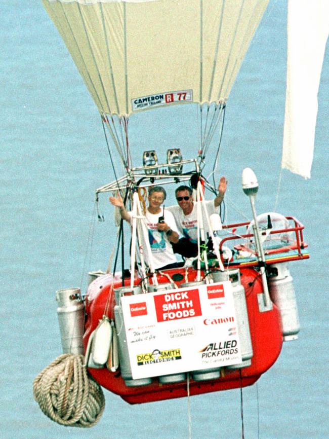 Dick Smith and Co-Pilot John Wallington wave before their beach landing at Ten Mile beach north of Illuka. endurance records ballooning.