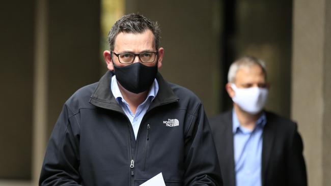 Victorian Premier Daniel Andrews and Chief Health Officer Brett Sutton arrive for a daily briefing on Saturday. Picture: Darrian Traynor Source: Getty Images