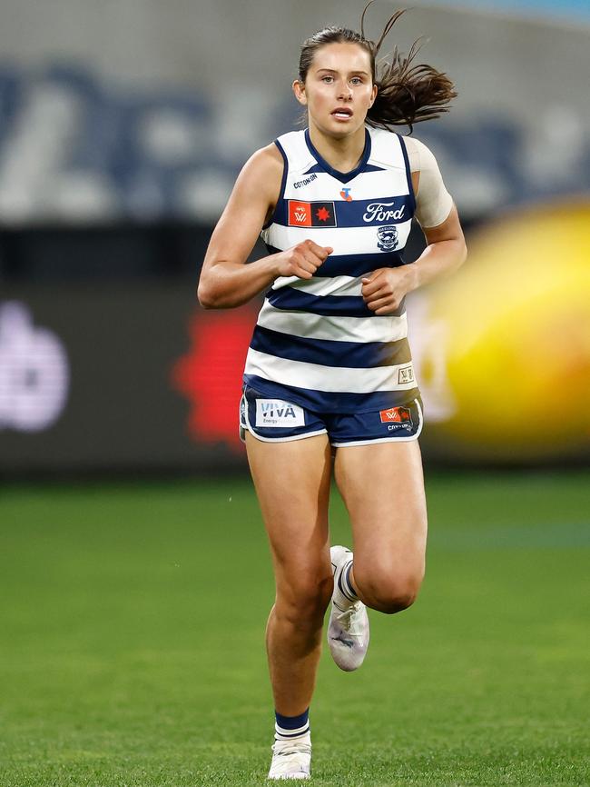 Bryde O'Rourke returns to the ground with her shoulder strapped up. Picture: Michael Willson/AFL Photos via Getty Images)