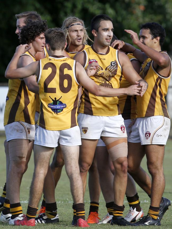 Hawks players celebrate a goal at a 2019 AFL Cairns Seniors match between Cairns Saints and Manunda Hawks. PICTURE: ANNA ROGERS