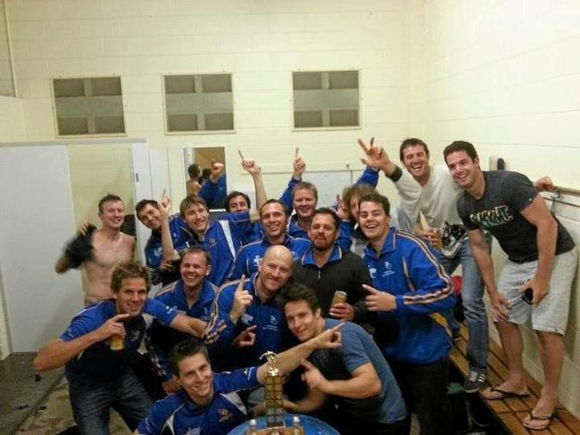 Lachy and his team in the sheds after the grand final win last year.