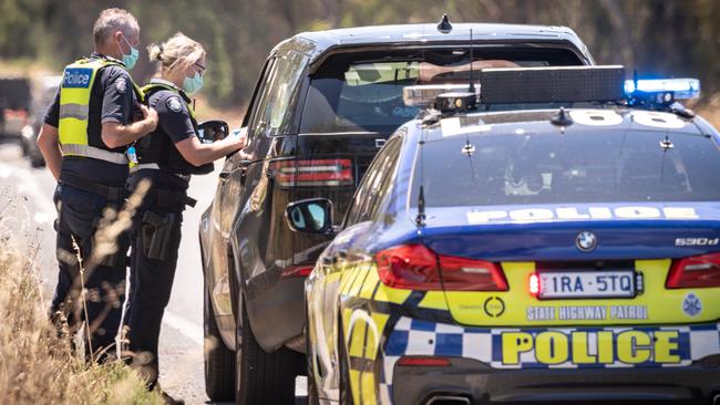 Police on the Hume Freeway near Wodonga pulling over motorists on Sunday. Picture: Simon Dallinger