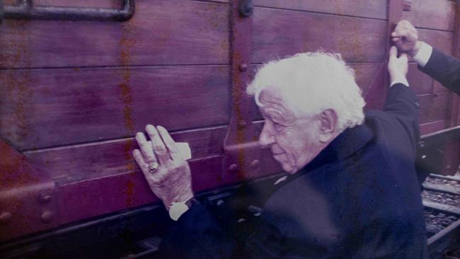 Sir Frank with the Nazi wagon he has restored and placed at Auschwitz.