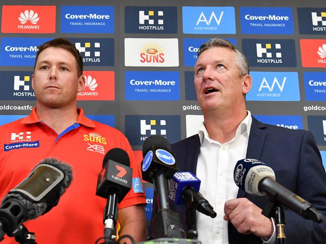 Gold Coast Suns coach Stuart Dew (left) and Chief Executive Mark Evans (right) are seen during a press conference at Metricon Stadium on the Gold Coast. Picture: AAP Image, Darren England.