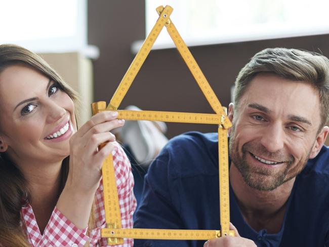 A happy couple of just signed up to their first home loan. Picture: iStock.